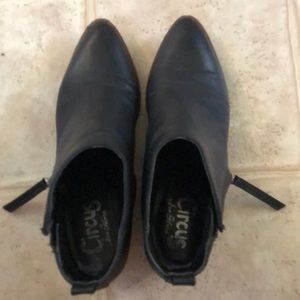 Black ankle booties. Zipper side opens and closes